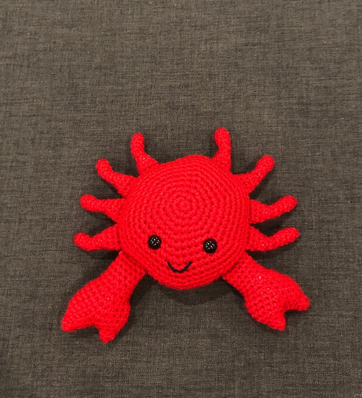 Happy sea creature in red 