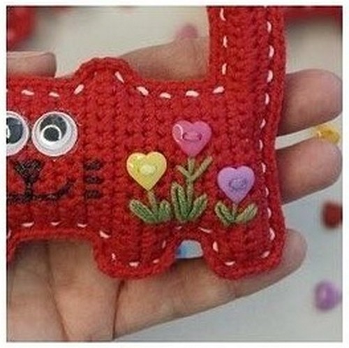 Make embroidery or sew on decorative buttons